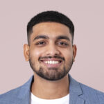 smiling businessman face portrait, wearing suit